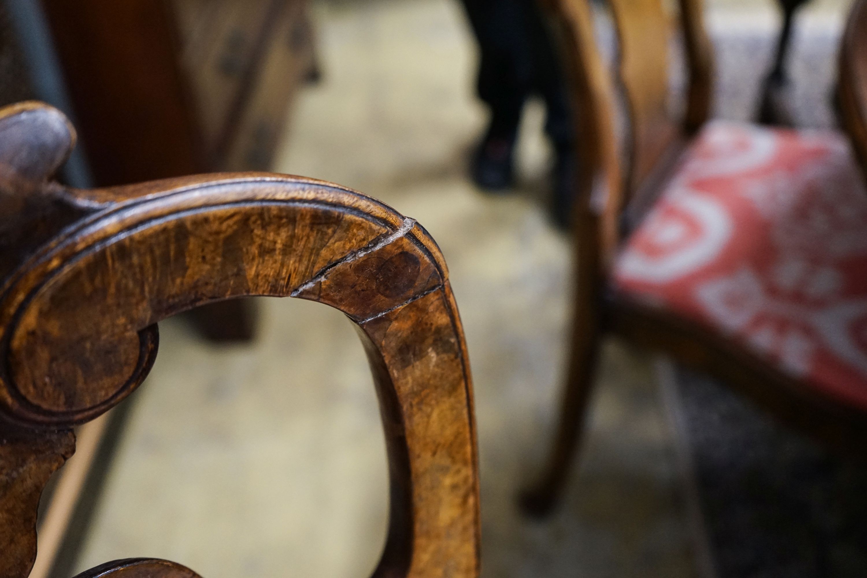 A set of four Queen Anne revival walnut dining chairs